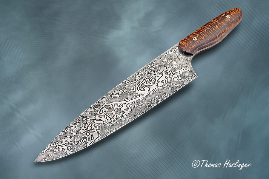 10.5" bladed Carbon Damascus Chef with Curly Koa Handle left view